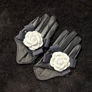 Elegant Black Gloves with White Floral Accent